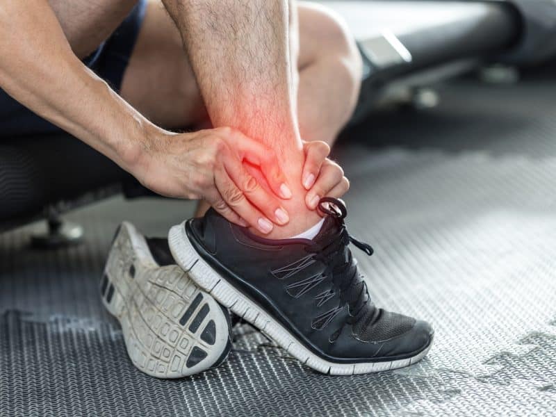 Asian,Man,Injury,Ankle,Pain,After,Training,Running,Workout,In